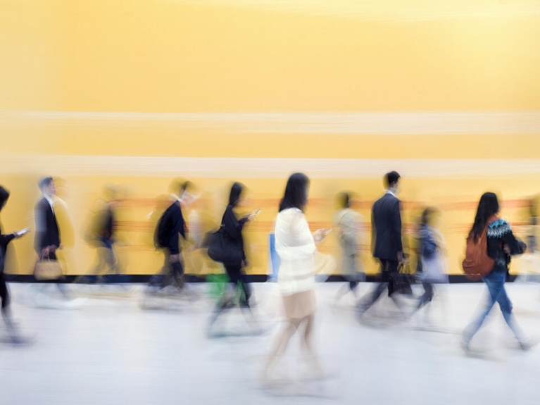 Blurred image of people walking