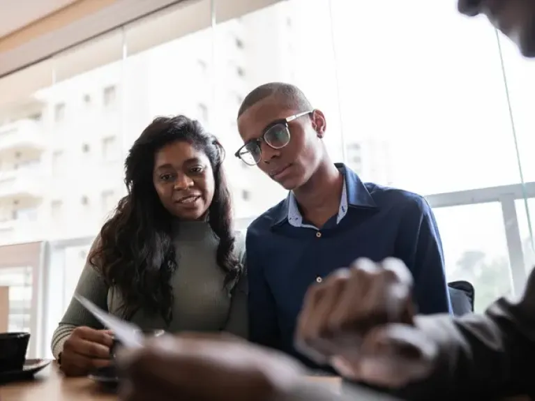 Two people reviewing documents