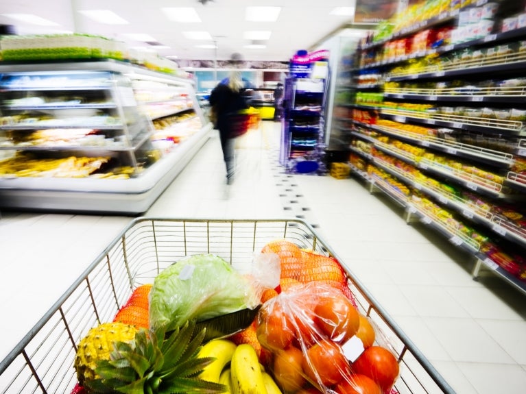 Grocery shopping cart in a food aisle