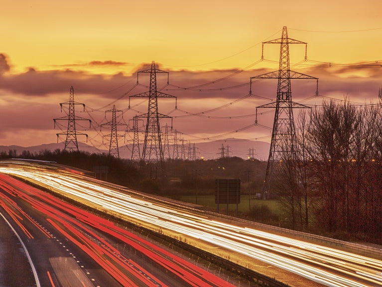 Powerlines next to busy road