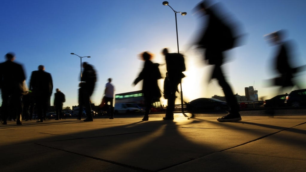 People on the street at dusk