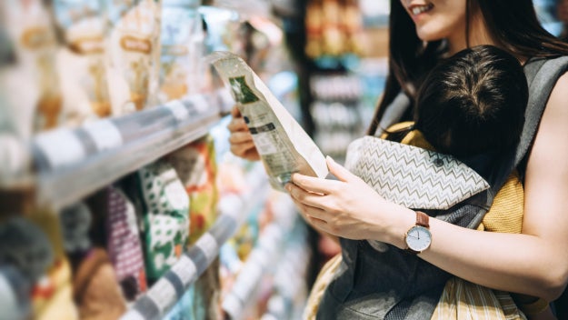 Woman reading food label